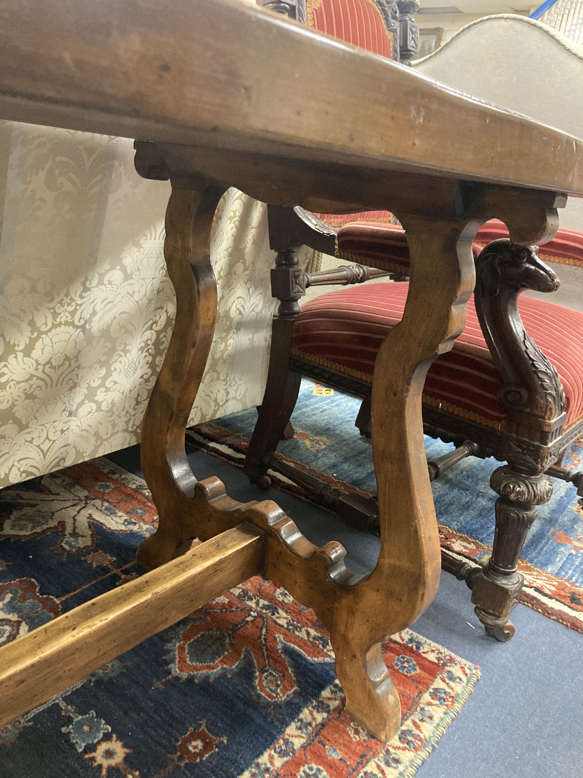 An 18th century Tuscany walnut dining table, with a later top, width 175cm, depth 70cm, height 80cm